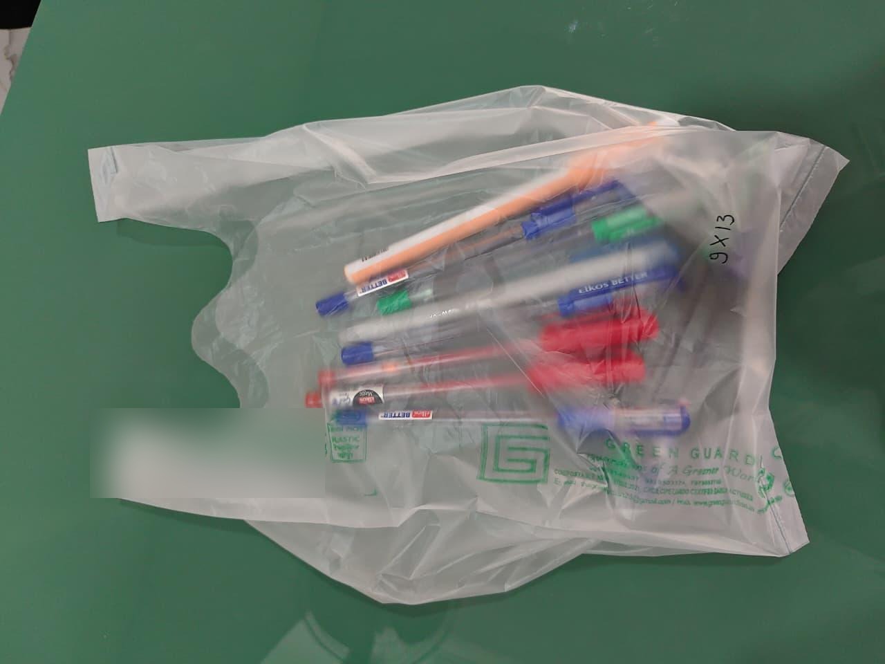 Green Guardian compostable bag holding items
